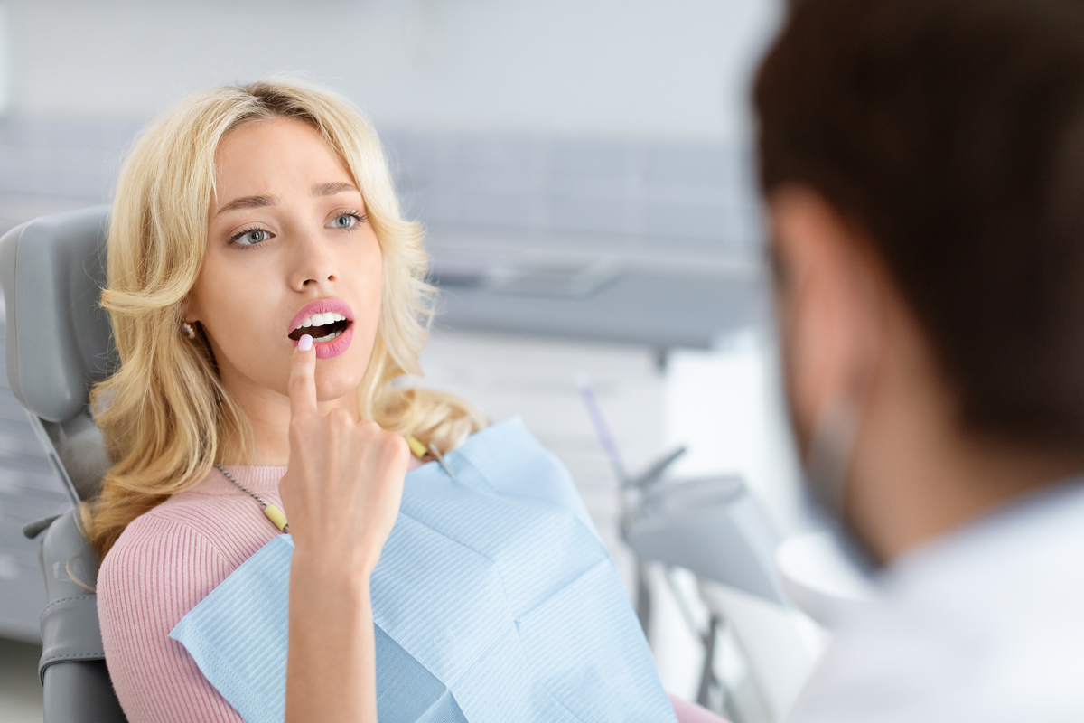 Patient discussing uneven whitening results during dental consultation